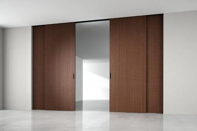 STRATUS - UNFLEX-3D, Alu, модель Tartan, объемная 3D поверхность, натуральный шпон UT40 Noce Italiano. Алюминиевая торцевая кромка в отделке AL10 Black Matt, трек и ручка в отделке AL08 Black. Раздвижная перегородка в проёме, скрытый трек в потолке.